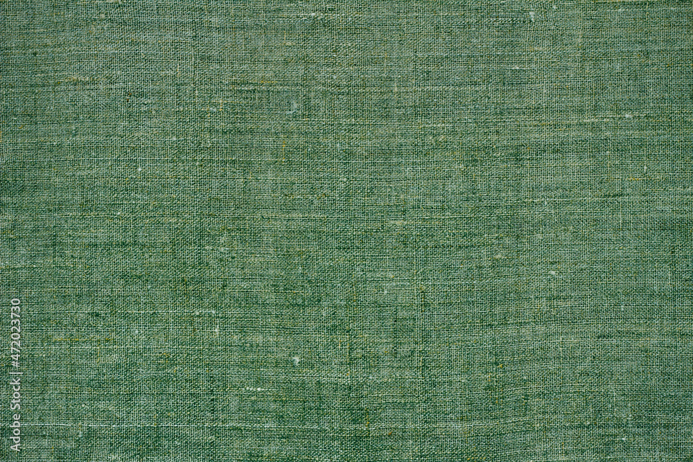 Fototapeta premium Green natural linen fabric, background or texture