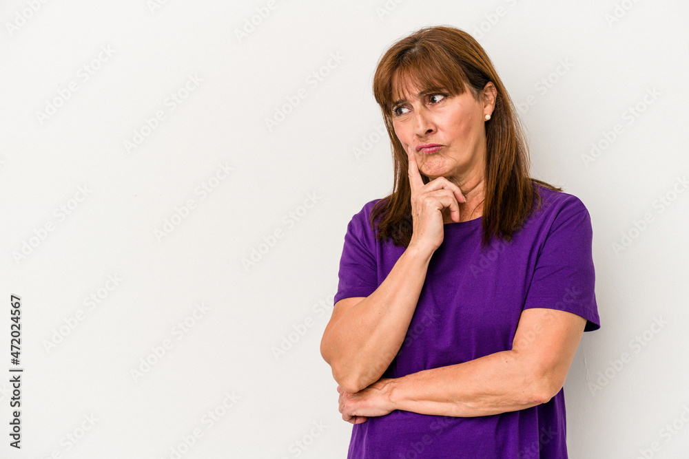 Middle age caucasian woman isolated on white background looking sideways with doubtful and skeptical expression. Middle age caucasian woman isolated on white background looking sideways with doubtful and skeptical expression.
