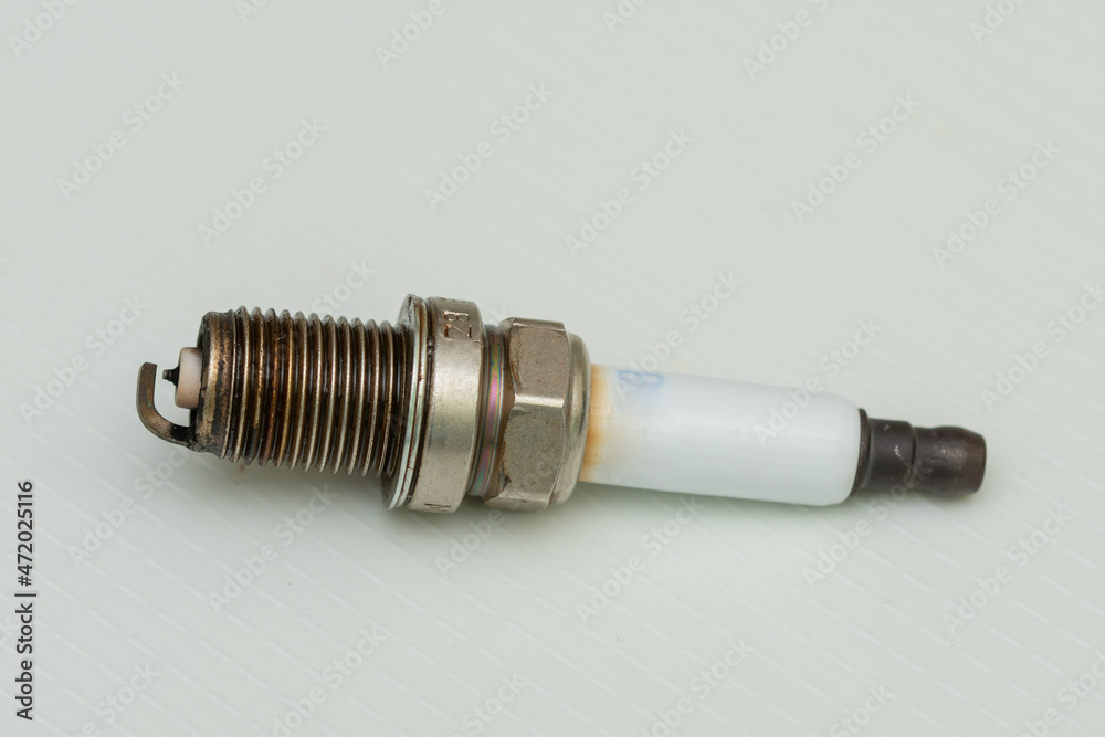 Set of car spark plugs on a white background Set of car spark plugs on a white background