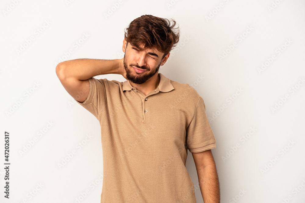 Fototapeta premium Young mixed race man isolated on grey background having a neck pain due to stress, massaging and touching it with hand.