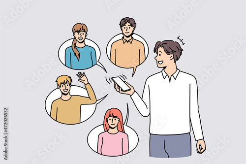 Smiling man use cellphone communicate with diverse friends online on social media. Happy guy with smartphone text message with colleagues on internet on gadget. Flat vector illustration. 