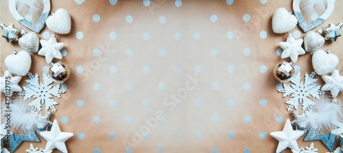 Christmas silver frame: ornaments background, basic classic pattern, place for text. Trendy decorations: disco balls, snowflakes, fluffy ornaments. Aesthetic festive atmosphere. Extra wide banner
