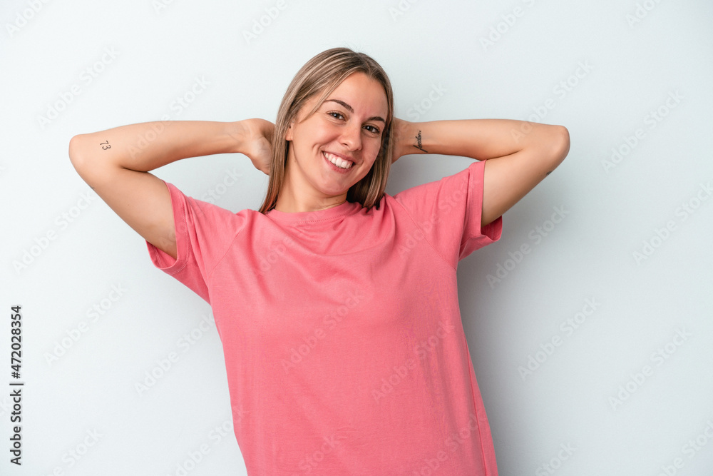 Young caucasian woman isolated on blue background stretching arms, relaxed position. Young caucasian woman isolated on blue background stretching arms, relaxed position.