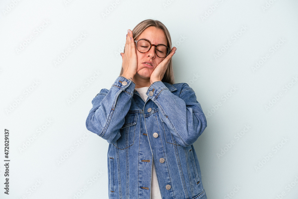 Young caucasian woman isolated on blue background whining and crying disconsolately. Young caucasian woman isolated on blue background whining and crying disconsolately.