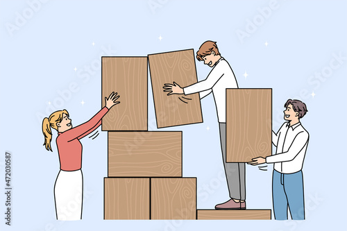 Businesspeople build tower with wooden blocks engaged in teambuilding activity together. Diverse employees involved in work, motivated for success. Business risk, teamwork. Vector illustration. 