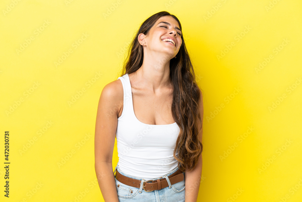 Young caucasian woman isolated on yellow background laughing Young caucasian woman isolated on yellow background laughing