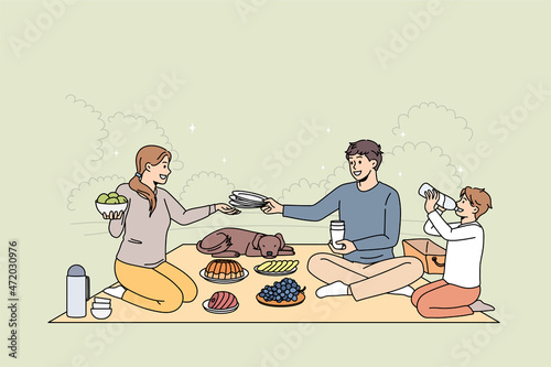 Happy family with child and dog sit on blanket in park enjoy weekend picnic together. Smiling parents relax with kid and pet eat out on leisure vacation summer time. Relaxation. Vector illustration. 