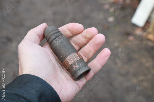 The artillery shell in hand