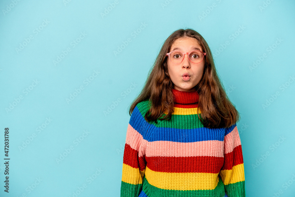 Little caucasian girl isolated on blue background Little caucasian girl isolated on blue background