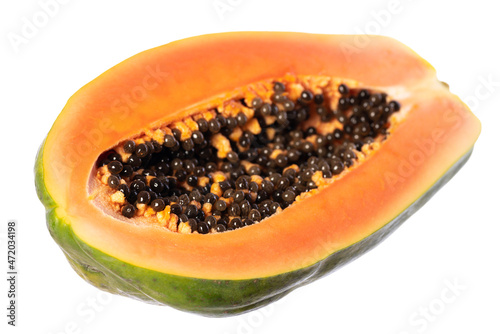 half of papaya with kernels isolated on white background