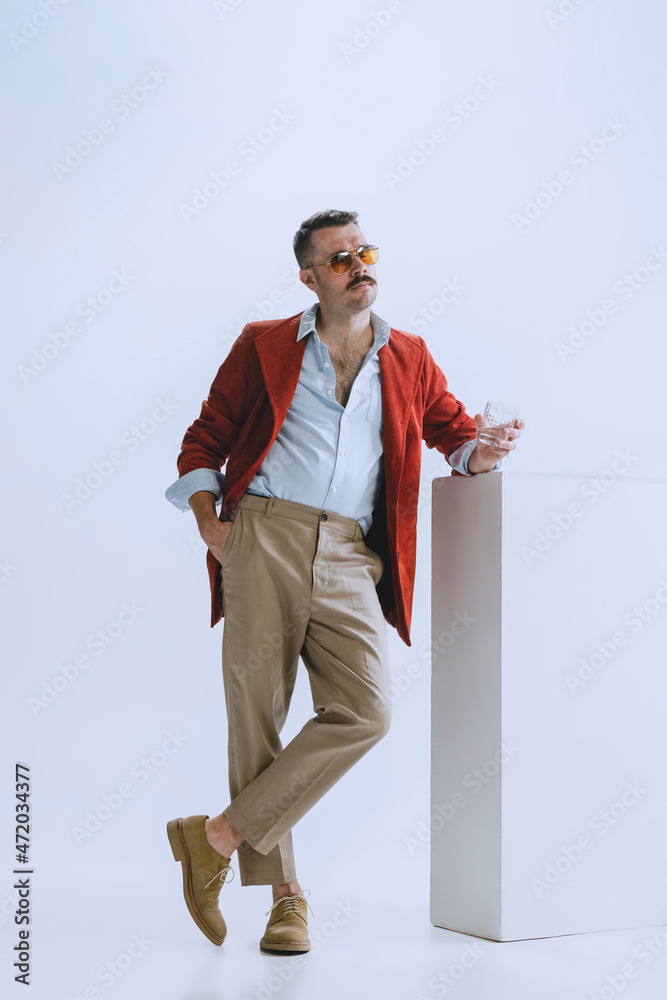 Portrait of young man, hipster or dandy, dude dressed in 50s, 60s style isolated on white background. retro vintage style
