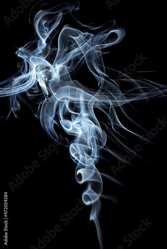 abstract white smoke swirls on black background