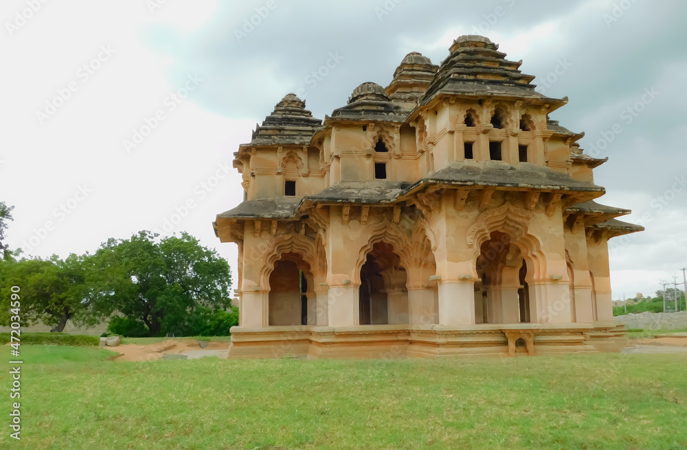 Ancient Hampi civilization ruins architecture Lotus Mahal green surroundings
