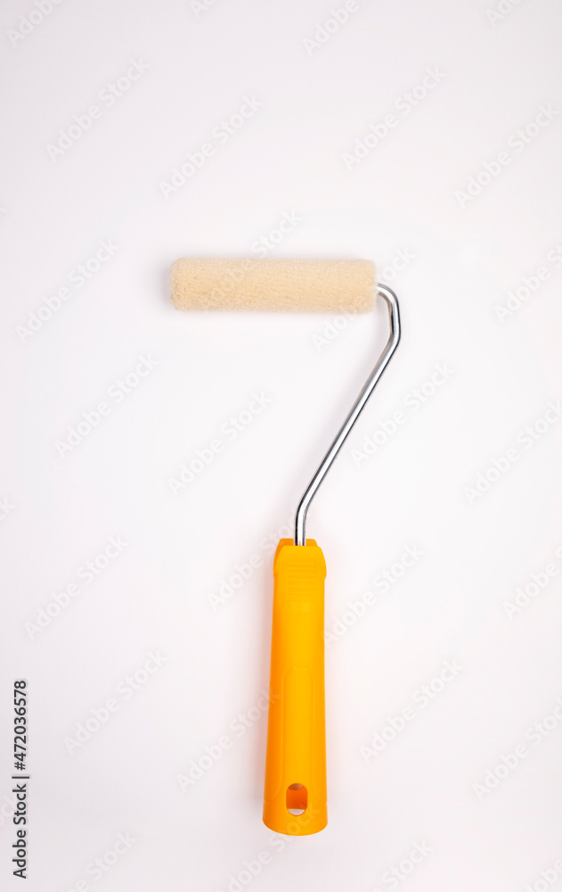Paint roller on a white background. Paint walls. Paint roller lies vertically Paint roller on a white background. Paint walls. Paint roller lies vertically