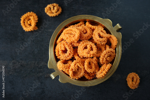 Rice murukku savoury Arisi murukku chakli chakali Pongal festival snack deep fried coconut oil traditional South Indian chennai Tamil Nadu India Kerala Sri Lanka, Onam, Vishu, Diwali Makar Sankranti photo