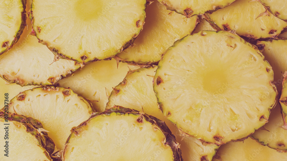 Pineapple juicy yellow slices background. Top view. Pineapple juicy yellow slices background. Top view.