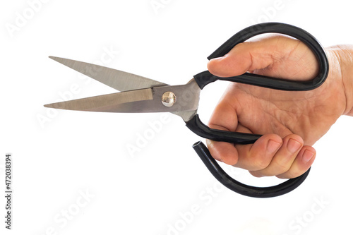 close up male hand holding scissors isolated on white