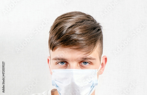 Young Man in a Flu Mask