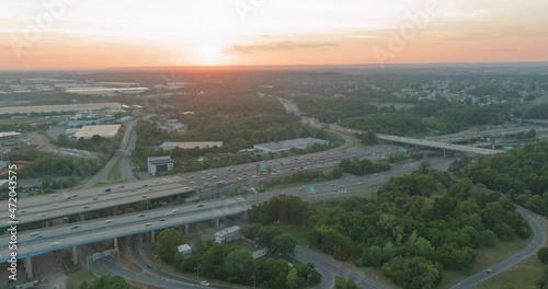 Aerial top view of huge complex road junction at cars driving on the Alfred E. Driscoll Bridge across the Raritan River New Jersey USA photo
