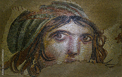 Gypsy girl mosaic in the Zeugma museum in Gaziantep, Turkey. The Museum is one of the largest mosaic collection in the world. The ancient city of Zeugma have been founded by Alexander the Great	
 photo