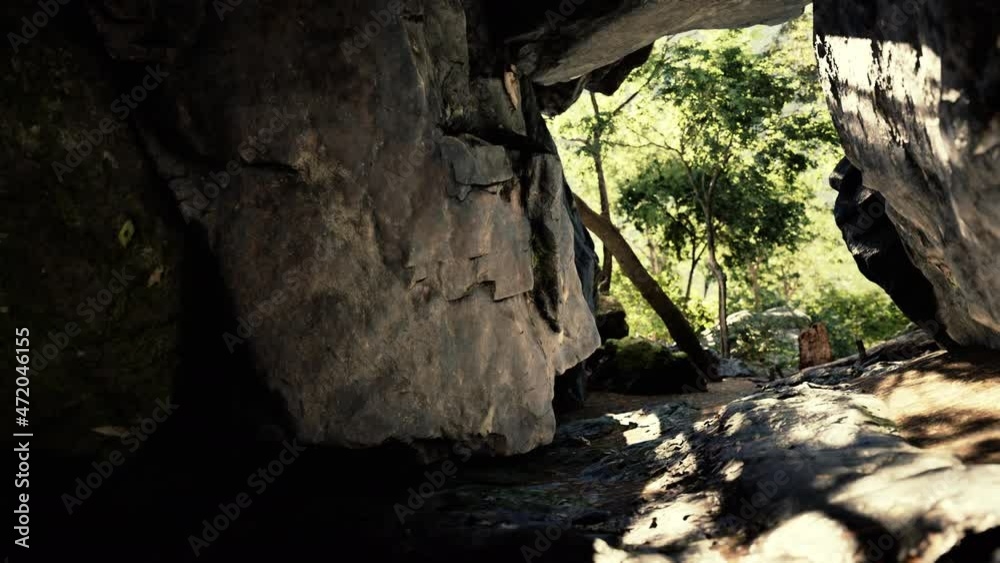 shot taken from inside a small cave looking out shot taken from inside a small cave looking out