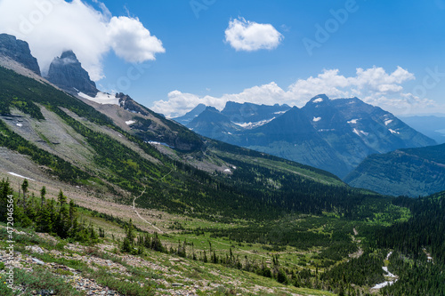 View of the Garden Wall, Grinnell Glacier Overlook, and the Continental Divide while hiking the Highline Trail in Glacier National Park in Montana on a sunny summer day