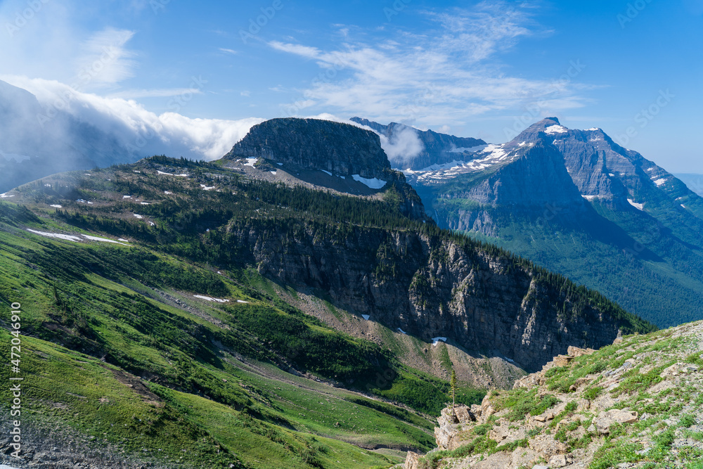 View of Mount Oberlin and Bearhat Mountain in Glacier National Park as viewed from hiking on the Highline Trail by the Going to the Sun Road on a sunny summer day