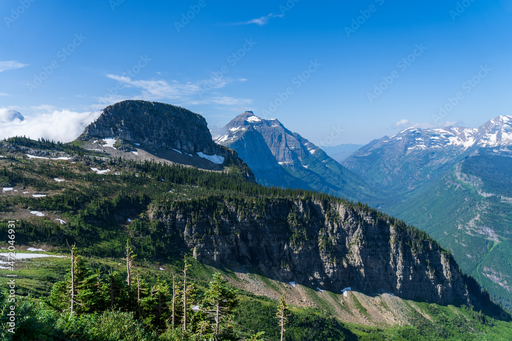 Fototapeta premium View of Mount Oberlin and Bearhat Mountain in Glacier National Park as viewed from hiking on the Highline Trail by the Going to the Sun Road on a sunny summer day