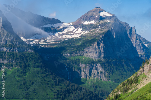 View of Bird Woman Falls, Clements Mountain, and Mount Cannon from the Highline Trail and Going to the Sun Road in Glacier National Park in Montana on a summer day photo