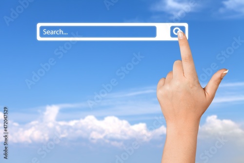 A man standing with hands pointing to information search, clicking to virtual internet search page