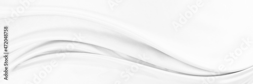 White gray satin texture that is white silver fabric silk panorama background with beautiful soft blur pattern natural.