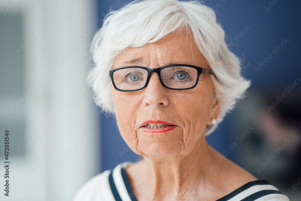Senior woman with eyeglasses at home Senior woman with eyeglasses at home