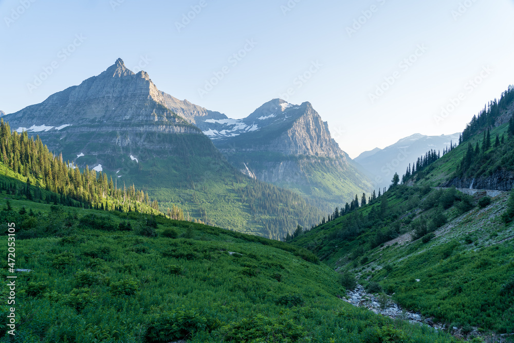 View of Mount Oberlin and Clements Mountain in Glacier National Park as viewed from hiking by Oberline Bend on the Going to the Sun Road on a sunny summer evening at sunset and golden hour