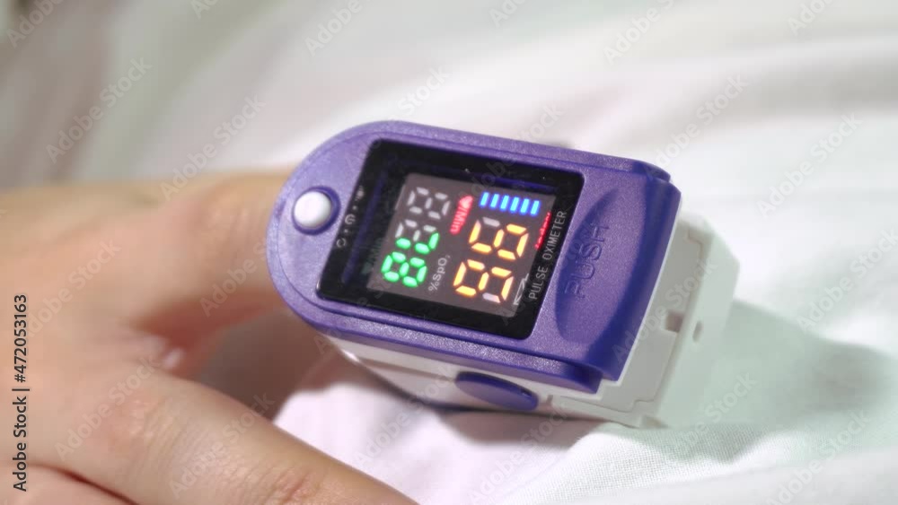 Pulse oximeter on the patient's finger.Close-up.Coronavirus. Lung disease. Pulse oximeter on the patient's finger.Close-up.Coronavirus. Lung disease.