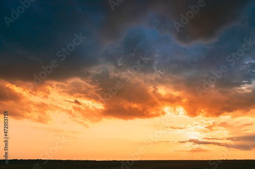 Meadow At Sunset Sunrise. Natural Bright Dramatic Sky In Different Colours Above Countryside Meadow Landscape. Agricultural Landscape © Grigory Bruev