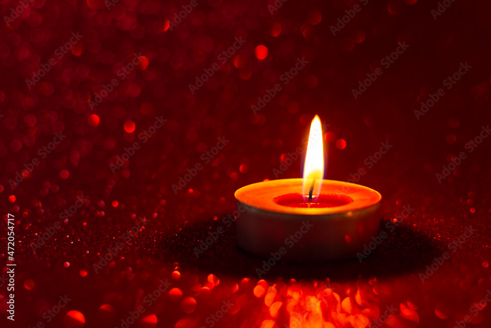 Candles red glitter background. Blurry red background with a little bokeh. Beautiful festive sensual composition. The concept of Valentine's day, wedding, birthday. Merry Christmas and Happy New Year Candles red glitter background. Blurry red background with a little bokeh. Beautiful festive sensual composition. The concept of Valentine's day, wedding, birthday. Merry Christmas and Happy New Year