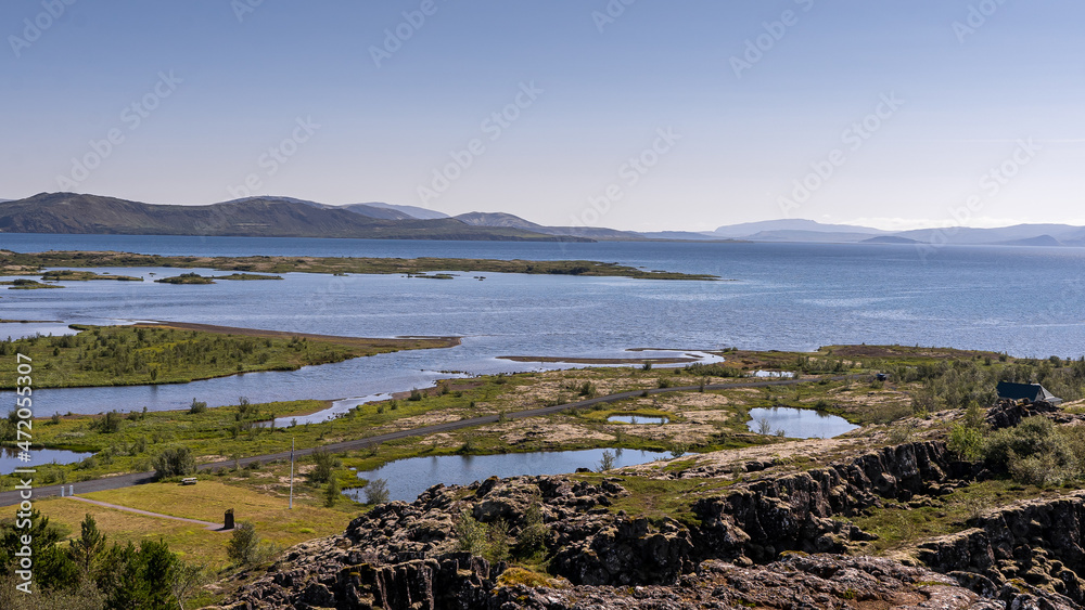 View of Thingvellir national park, Iceland's parliament, the Thingvellir Church and the ruins of old stone shelters, hikes and lake