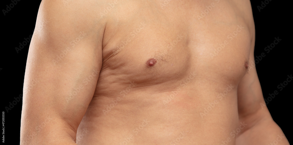 Inflated muscles of a man on a black background. Inflated muscles of a man on a black background.