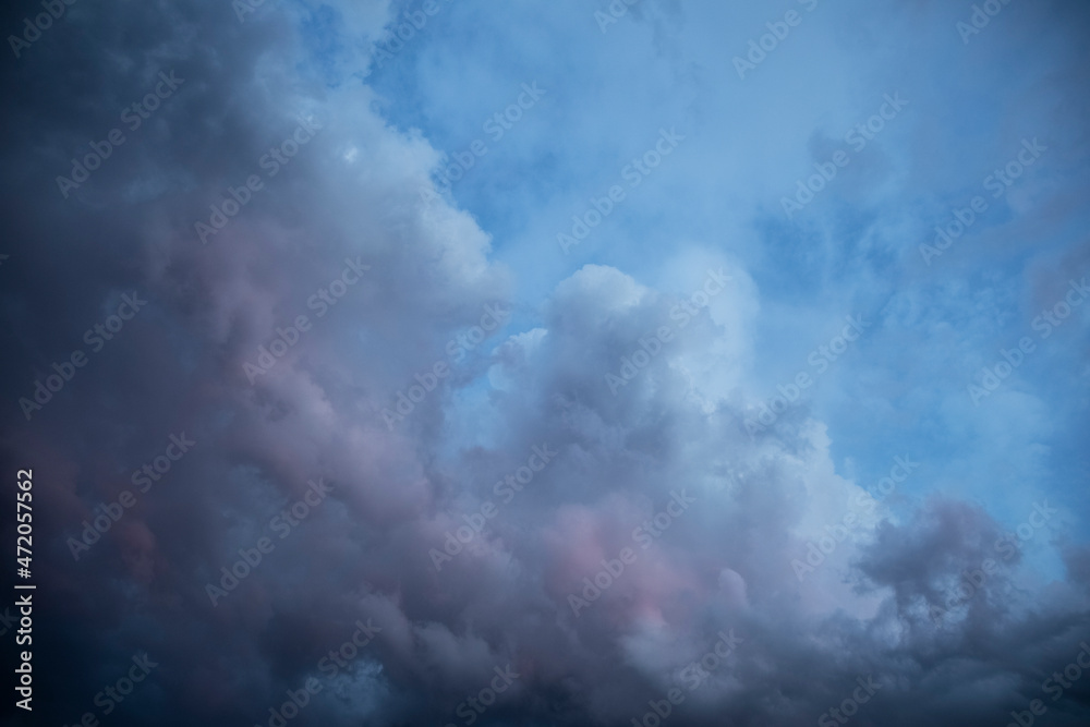 Natural background of dark stormy clouds in gray sky
