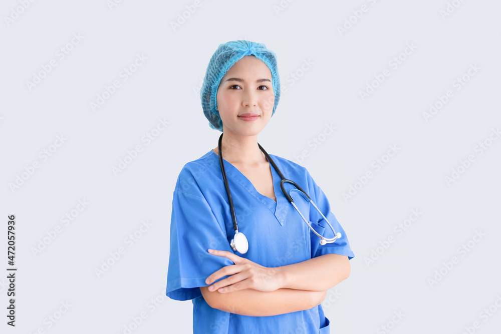 Smiling female doctor in lab coat crossing arms against white background Smiling female doctor in lab coat crossing arms against white background