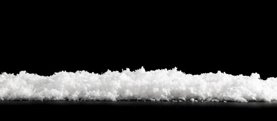 White snow isolated on black background