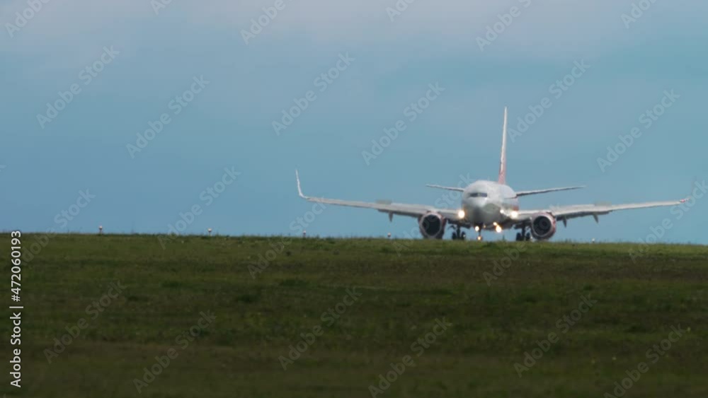 Jet airplane braking after landing Jet airplane braking after landing