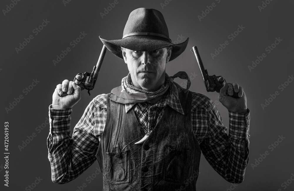 Man wearing cowboy hat, gun. Portrait of a cowboy. West, guns. Portrait of a cowboy. Western man with hat. Portrait of farmer or cowboy in hat Man wearing cowboy hat, gun. Portrait of a cowboy. West, guns. Portrait of a cowboy. Western man with hat. Portrait of farmer or cowboy in hat