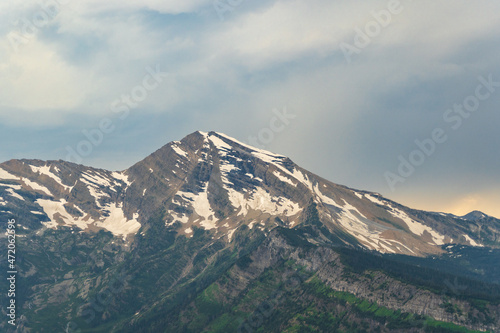 View of Heavens Peak in Glacier National Park at sunset by the Going to the Sun Road on a sunny summer day