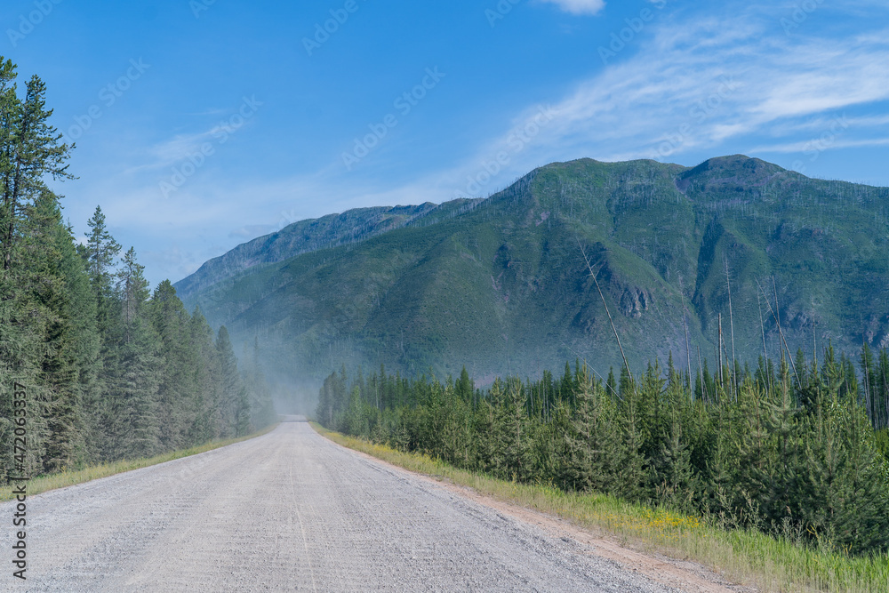 North Fork Road section headed to Bowman Lake and Kintla Lake in Glacier National Park near Polebridge, Montana on a sunny summer day North Fork Road section headed to Bowman Lake and Kintla Lake in Glacier National Park near Polebridge, Montana on a sunny summer day