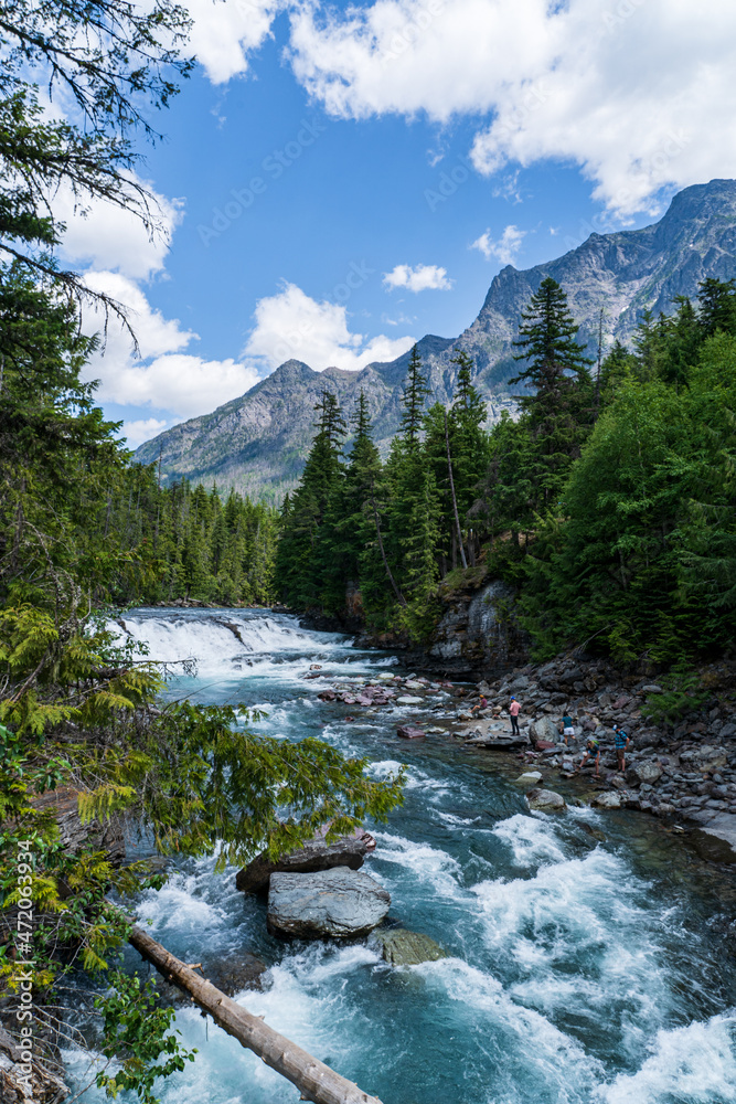 Sacred Dancing Cascade in Glacier National Park in Montana on a beautiful summer day Sacred Dancing Cascade in Glacier National Park in Montana on a beautiful summer day