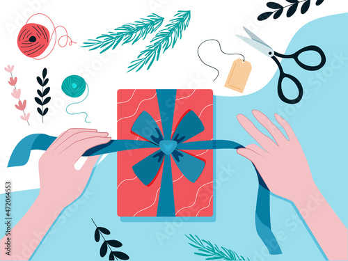 Gift wrapping. Women's hands tie a ribbon with a bow. The season of giving concept. Vector illustration in a flat style. Gift box packaging