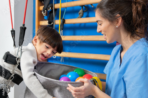 Disabled child is playing, learning and exercising in rehabilitation therapy hospital, Lifestyle of a child with disability. Happy disability kid concept .