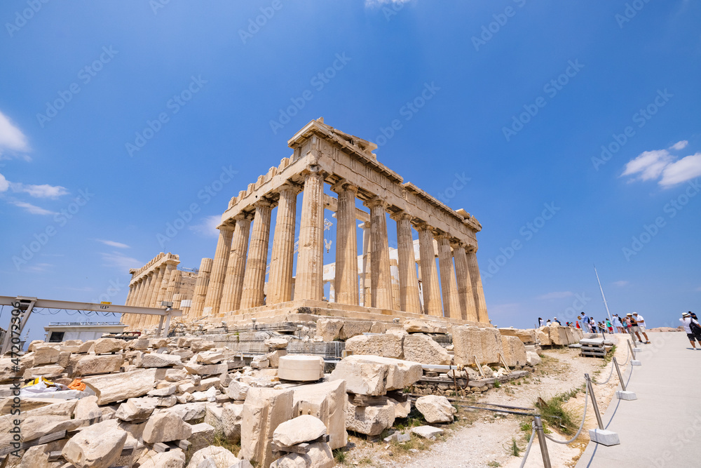 Parthenon Temple at Acropolis hill, in Athen, Greece. The famous old Acropolis is a top landmark of Athens. Scenic view of remains of ancient Athens.