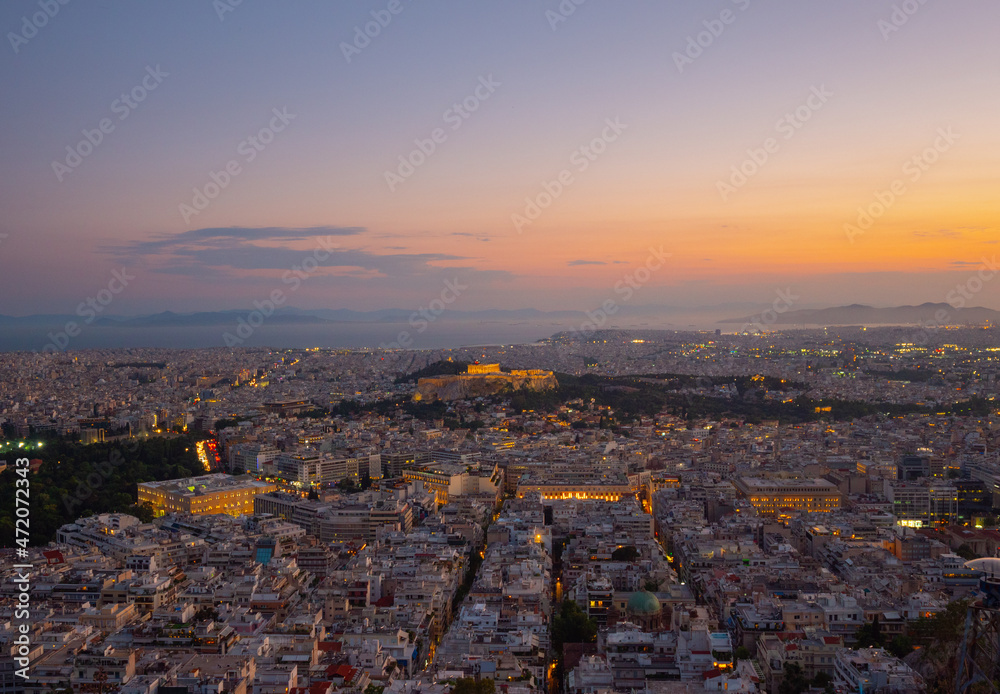 Evening sunset view from Lycabettus hill of the ancient Parthenon on Acropolis Hill  in central Athens, Greece